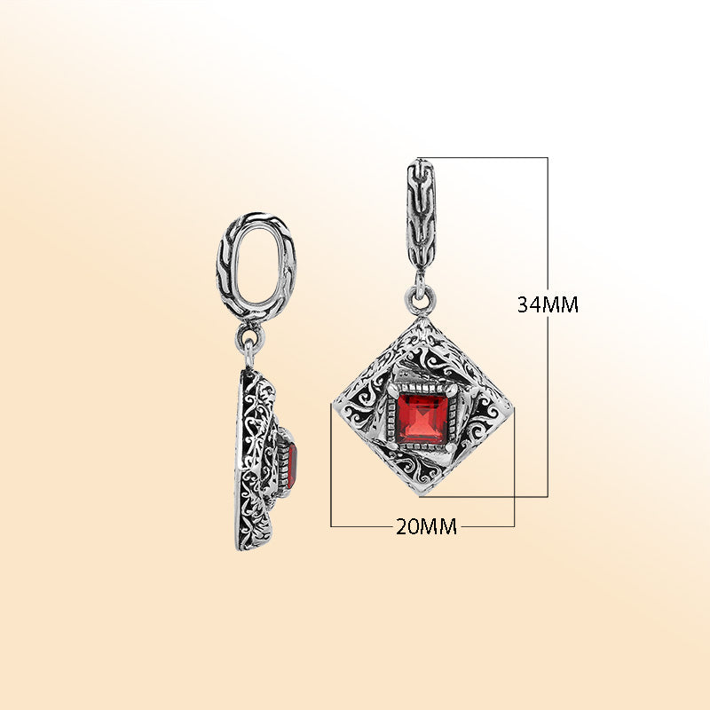 Handcrafted sterling silver diamond-shaped pendant with red garnet quartz square center, intricate filigree engravings, and mirror-polished high-gloss finish.