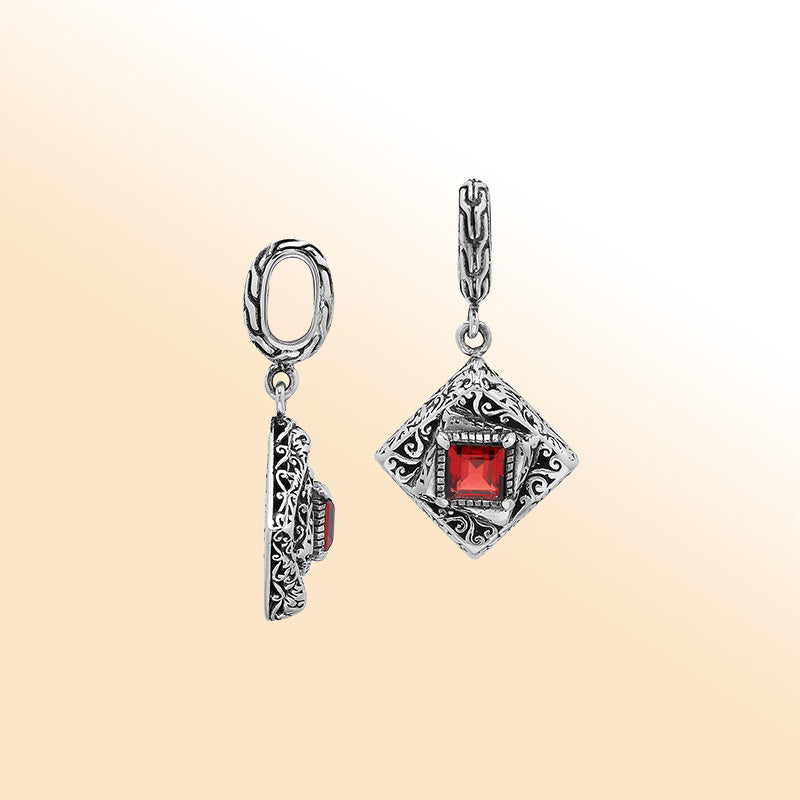 Handcrafted sterling silver diamond-shaped pendant with red garnet quartz square center, intricate filigree engravings, and mirror-polished high-gloss finish.