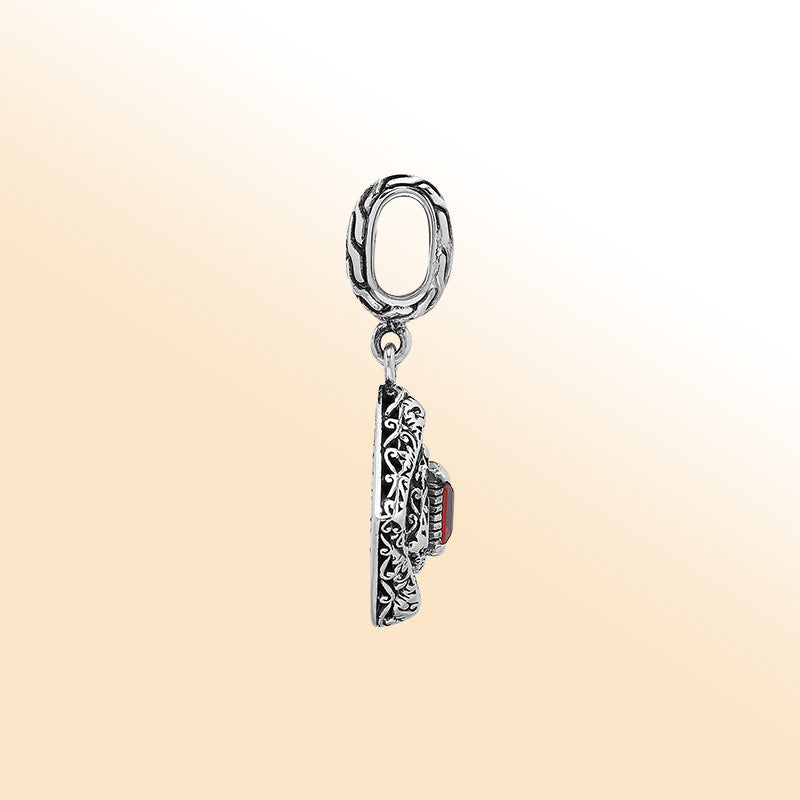 Handcrafted sterling silver pendant with square citrine quartz centerpiece, artistic filigree engravings, and polished finish reflecting Balinese craftsmanship.