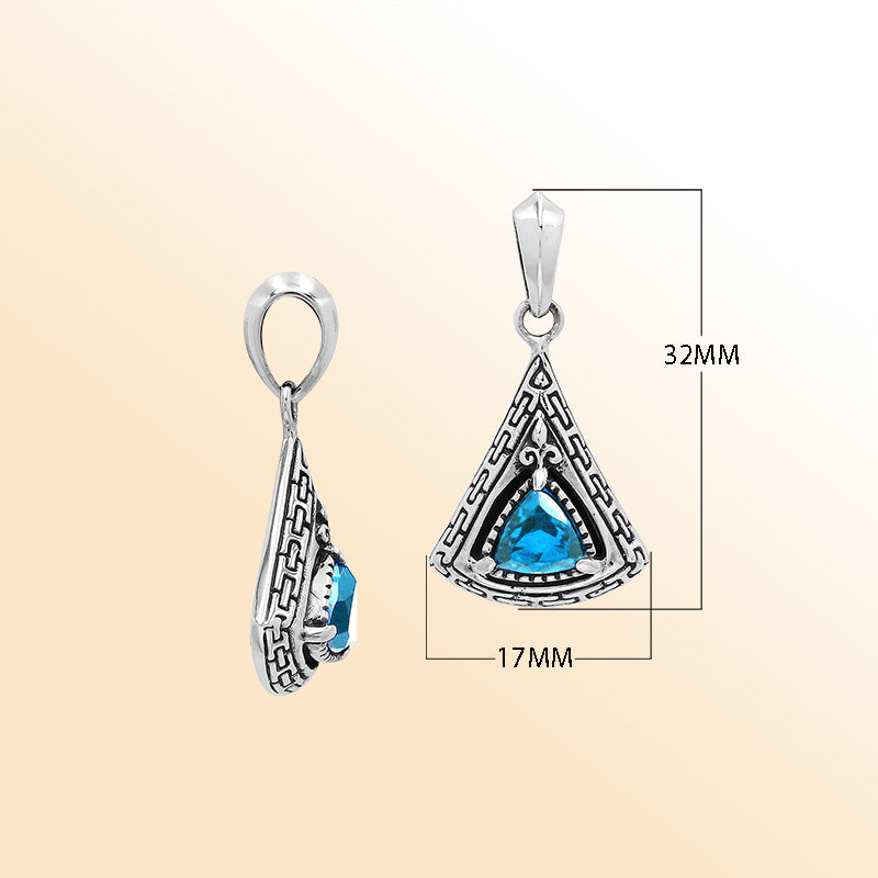 Handcrafted sterling silver triangular pendant with trillion-cut blue topaz quartz, geometric engravings, and high-gloss polished Balinese detailing.