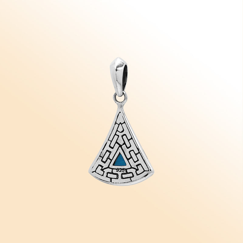 Handcrafted sterling silver triangular pendant with trillion-cut blue topaz quartz, geometric engravings, and high-gloss polished Balinese detailing.
