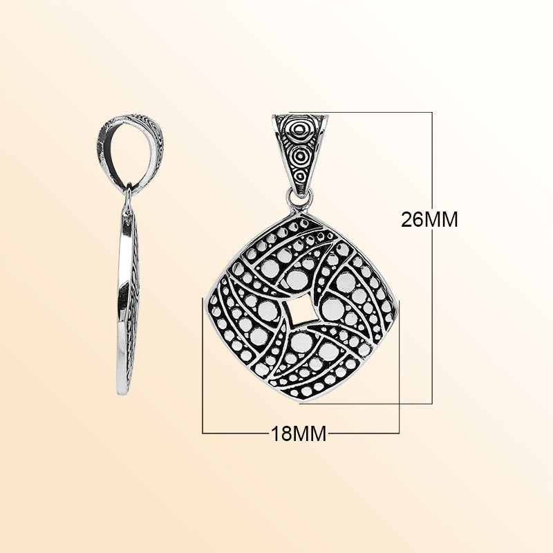 Handcrafted sterling silver diamond-shaped pendant with circular dot engravings, oxidized details, and polished Balinese geometric pattern.