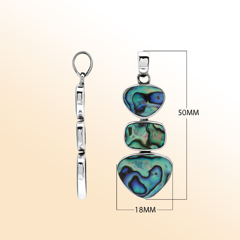 Handcrafted sterling silver triple-shape pendant with abalone shell, smooth polished surface, and ocean-inspired Balinese craftsmanship.