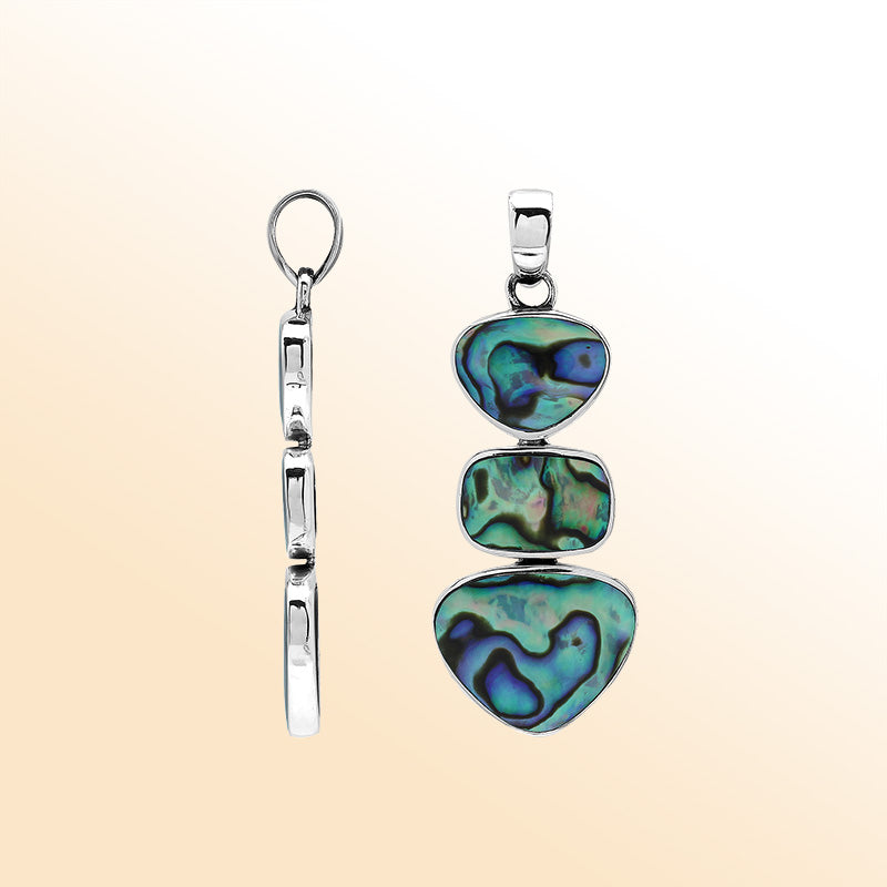 Handcrafted sterling silver triple-shape pendant with abalone shell, smooth polished surface, and ocean-inspired Balinese craftsmanship.