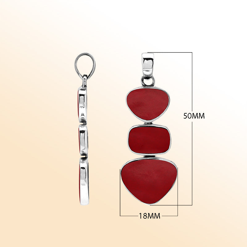Handcrafted sterling silver triple-shape pendant with Red Coral stones, smooth mirror-polished surface, and elegant Balinese artistry.