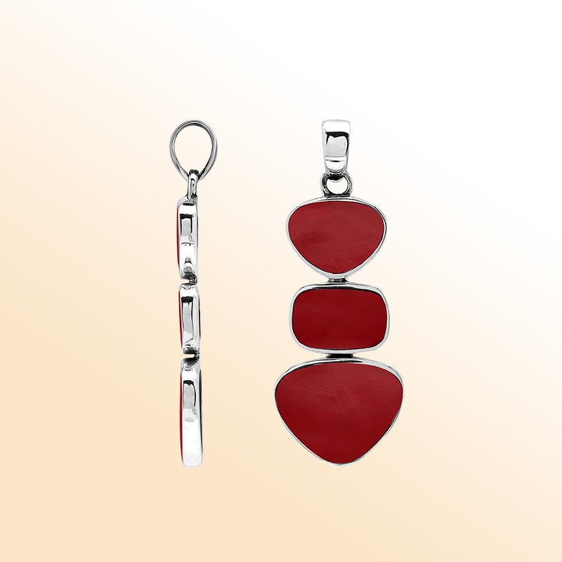 Handcrafted sterling silver triple-shape pendant with Red Coral stones, smooth mirror-polished surface, and elegant Balinese artistry.