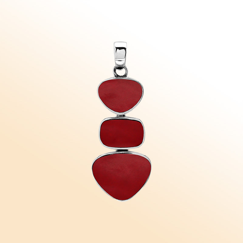 Handcrafted sterling silver triple-shape pendant with Red Coral stones, smooth mirror-polished surface, and elegant Balinese artistry.