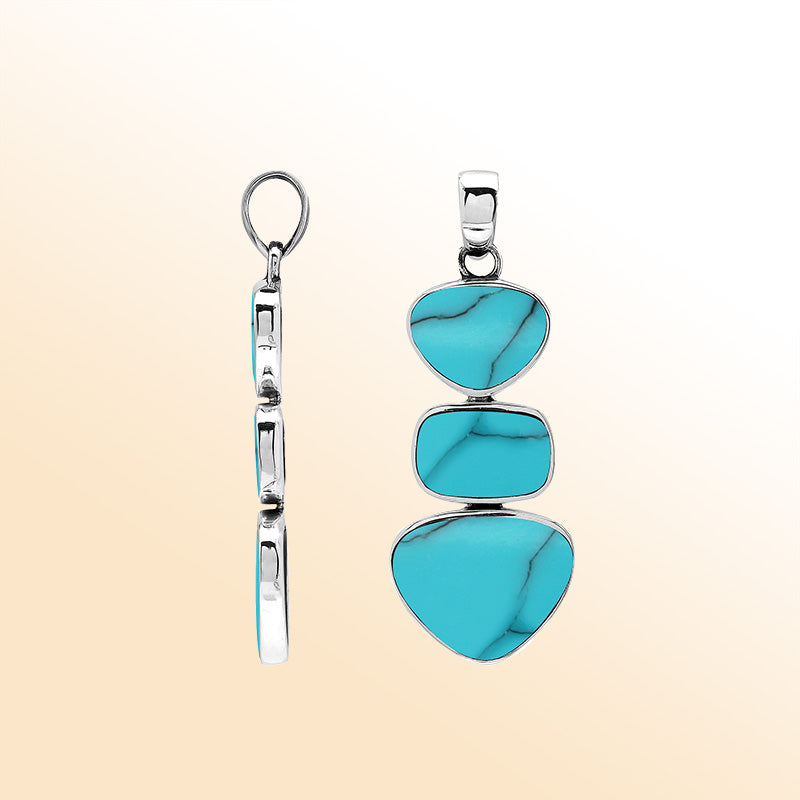 Handcrafted sterling silver pendant with three turquoise shell stones, smooth mirror-polished surface, and modern Balinese artistic detailing.