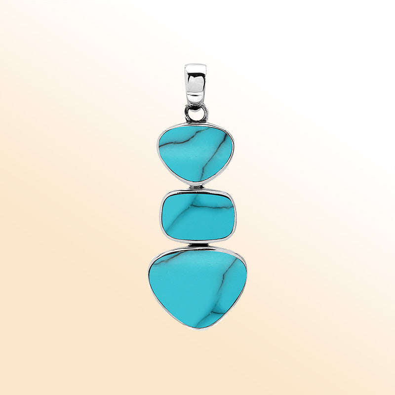 Handcrafted sterling silver pendant with three turquoise shell stones, smooth mirror-polished surface, and modern Balinese artistic detailing.