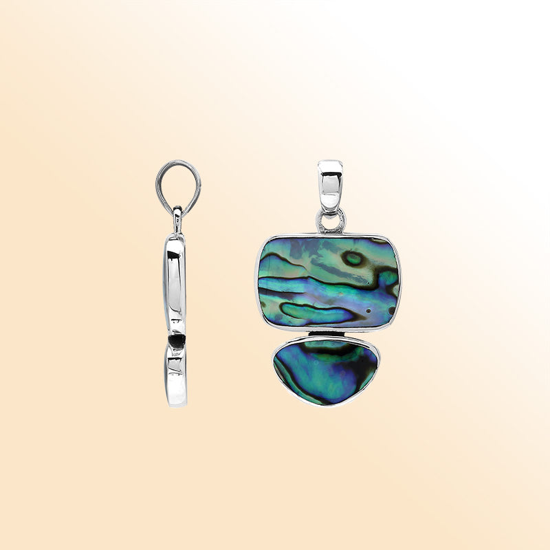 Handcrafted sterling silver double-shape pendant with abalone shell stones, smooth polished surface, and artistic Balinese design.