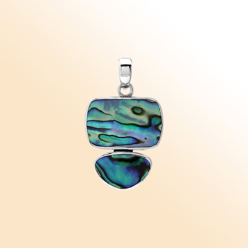 Handcrafted sterling silver double-shape pendant with abalone shell stones, smooth polished surface, and artistic Balinese design.
