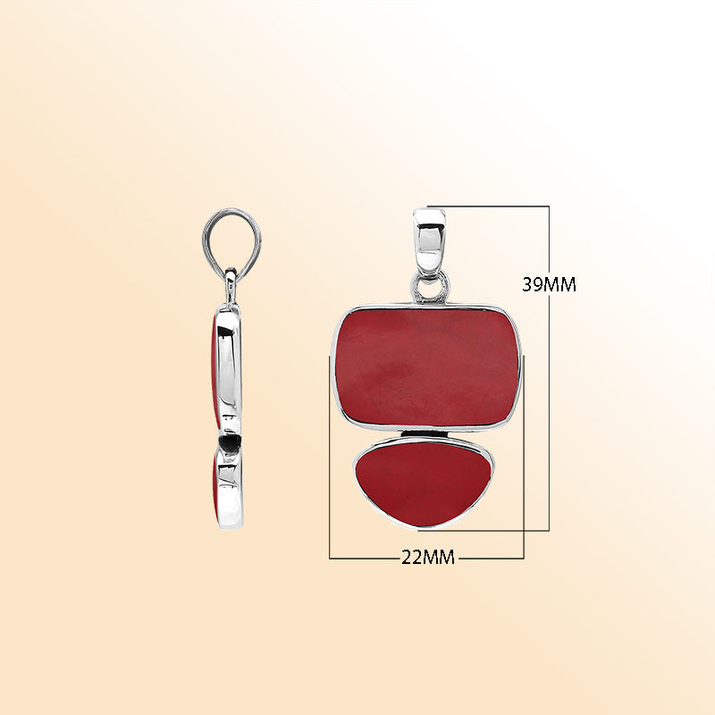 Handcrafted sterling silver double-shape pendant featuring Red Coral stones, polished smooth surface, and detailed Balinese artistry.