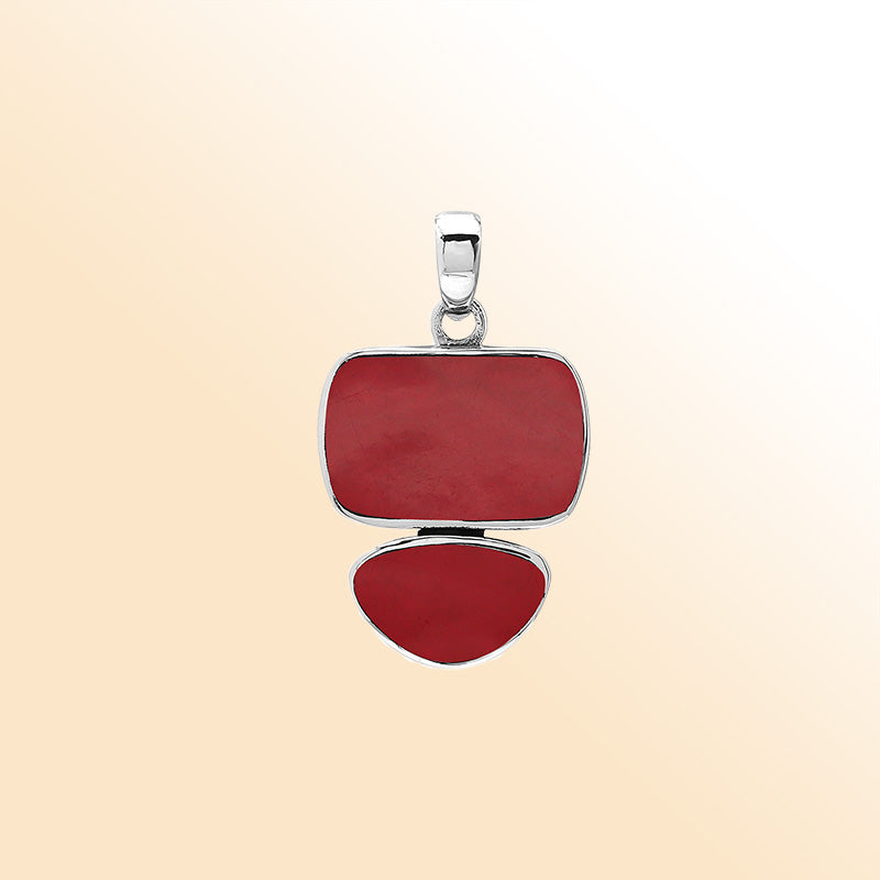 Handcrafted sterling silver double-shape pendant featuring Red Coral stones, polished smooth surface, and detailed Balinese artistry.