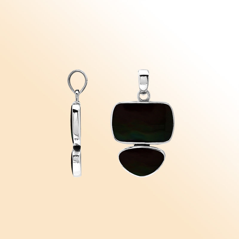 Handcrafted sterling silver pendant featuring two Black Shell stones, smooth mirror-polished surface, and fine Balinese artistry.