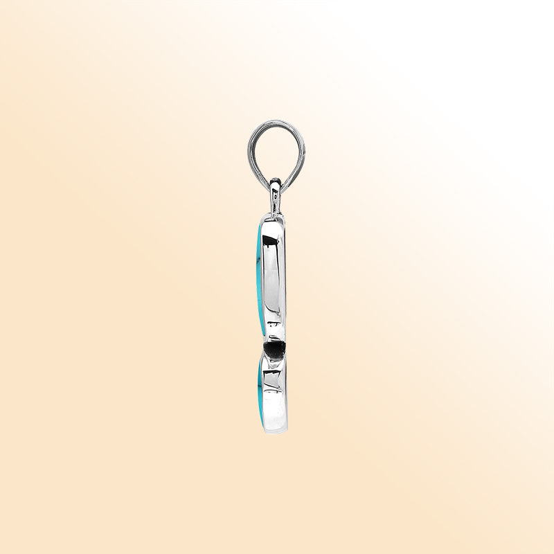 Handcrafted sterling silver pendant with two Turquoise Shell stones, mirror-polished surface, and detailed modern Balinese craftsmanship.