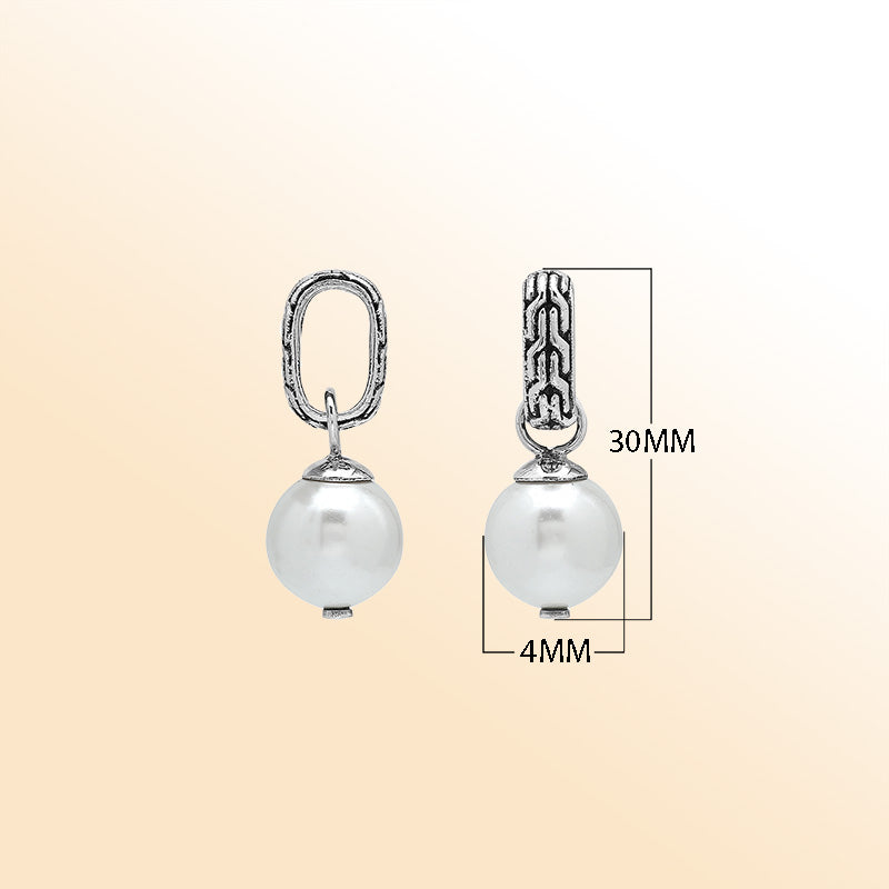 Elegant sterling silver round drop pendant featuring a radiant Mabe Pearl and Balinese silver detailing with smooth high-gloss finish.