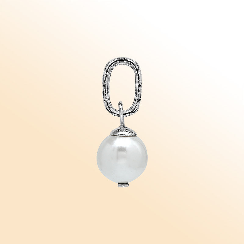 Elegant sterling silver round drop pendant featuring a radiant Mabe Pearl and Balinese silver detailing with smooth high-gloss finish.
