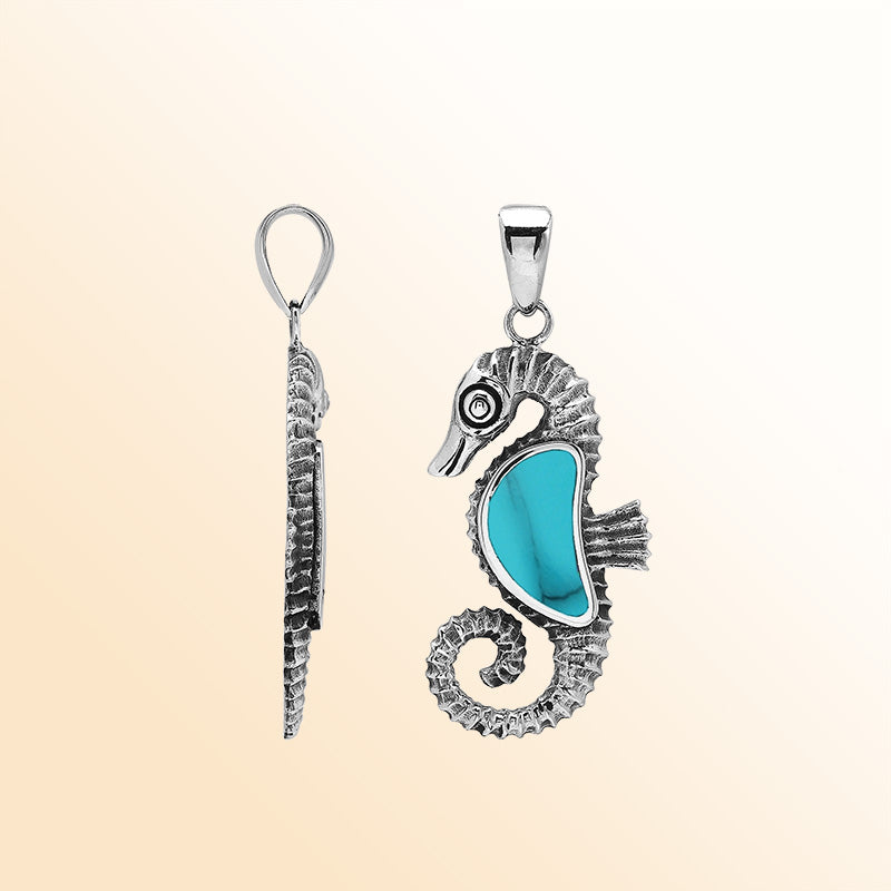 Handcrafted sterling silver seahorse pendant featuring turquoise shell and Balinese artistry with a polished finish.
