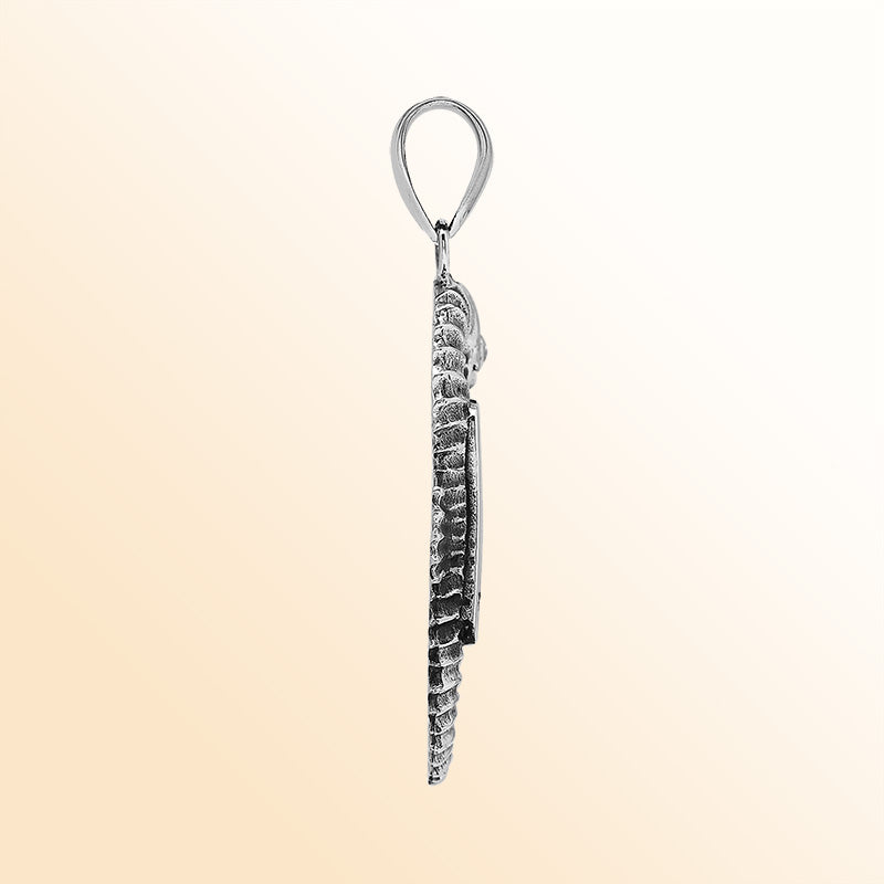 Handcrafted sterling silver seahorse pendant featuring turquoise shell and Balinese artistry with a polished finish.