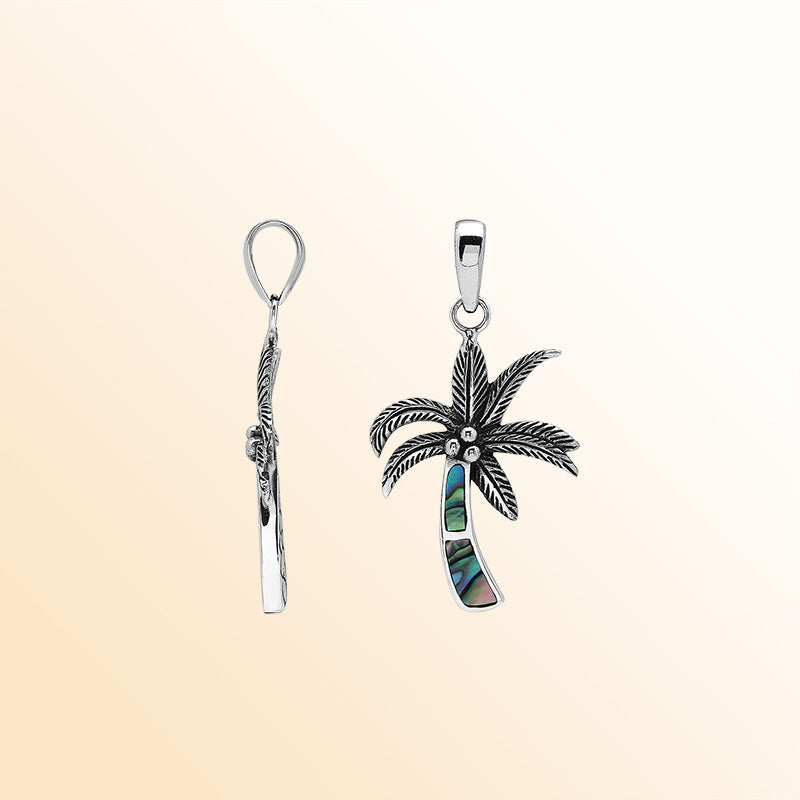 Elegant sterling silver palm tree pendant with shimmering abalone shell and Balinese craftsmanship in polished finish.