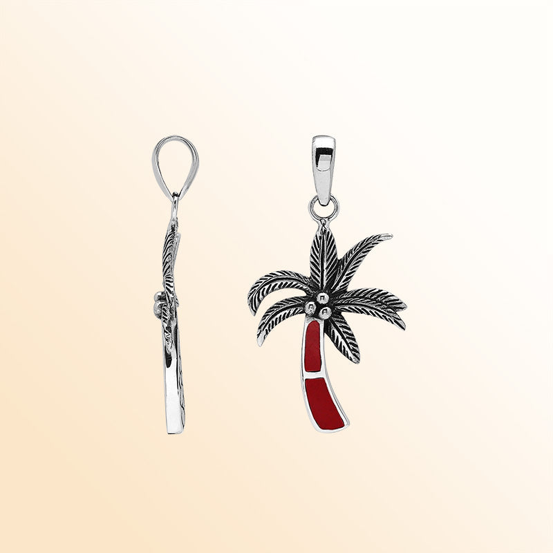 Elegant sterling silver palm tree pendant with red coral inlay and Balinese craftsmanship in a polished finish.