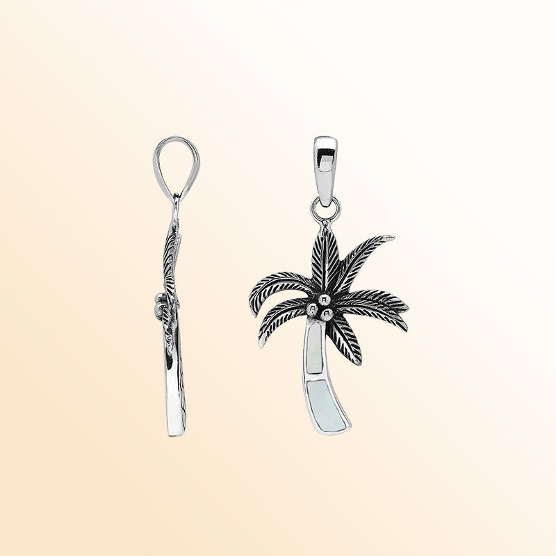 Elegant sterling silver palm tree pendant with mother of pearl inlay and Balinese craftsmanship in polished high-gloss finish.