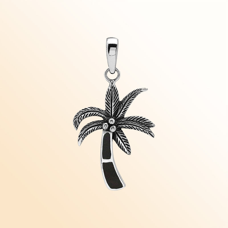 Elegant sterling silver palm tree pendant with black shell inlay and Balinese craftsmanship in a polished high-gloss finish.