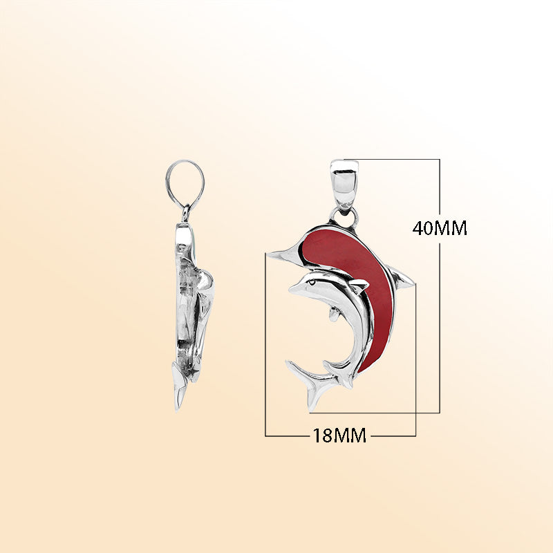Elegant sterling silver dolphin pendant with red coral inlay and Balinese craftsmanship in a high-polish ocean-inspired design.