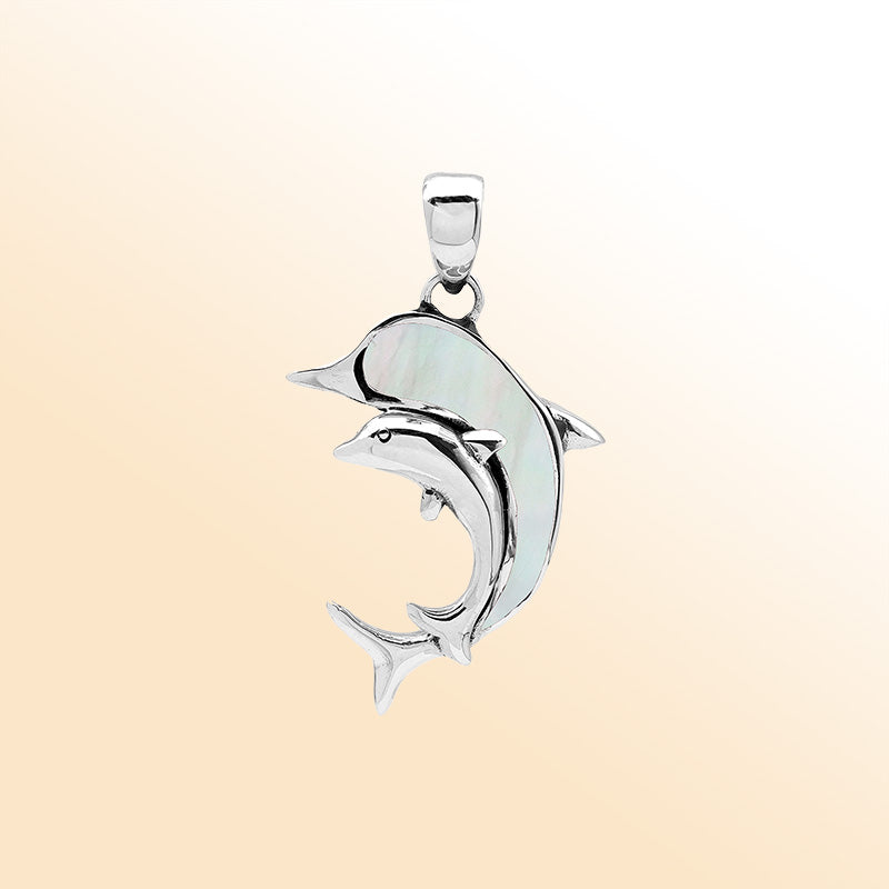 Elegant sterling silver dolphin pendant with mother of pearl inlay and Balinese craftsmanship in a polished ocean-inspired design.