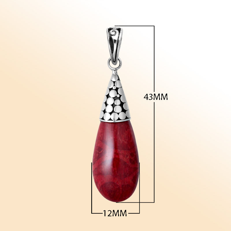 Elegant sterling silver teardrop pendant with red coral and polished Balinese dotted cap handcrafted in Bali.