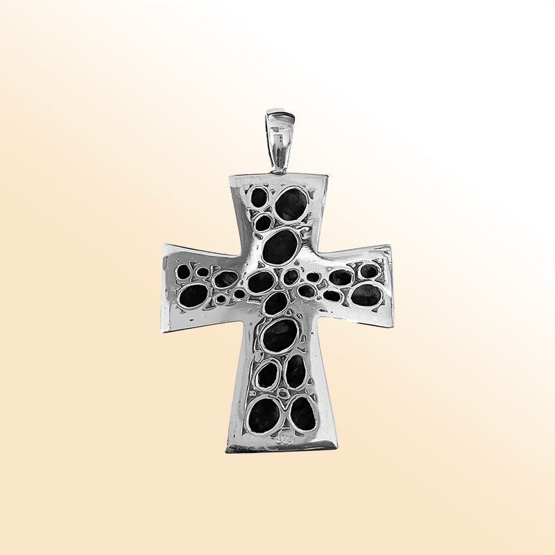 Artistic sterling silver cross pendant with polished pebble texture and oxidized Balinese handcrafted detailing.