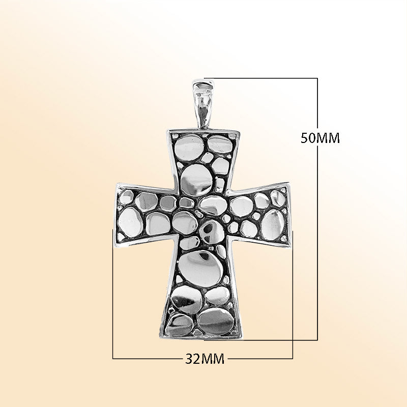 Artistic sterling silver cross pendant with polished pebble texture and oxidized Balinese handcrafted detailing.