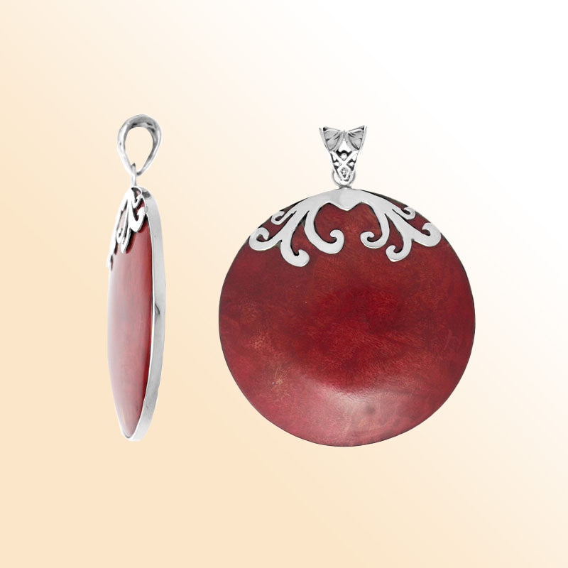 Elegant sterling silver Red Coral pendant with polished scroll design handcrafted in Bali.