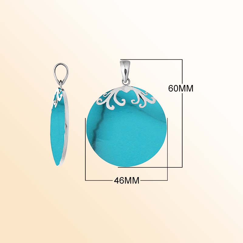 Elegant sterling silver circular pendant displaying luminous turquoise blue shell with subtle dark veins, delicate silver floral scroll accents crowning the upper edge, and a beautifully polished hanging bail.