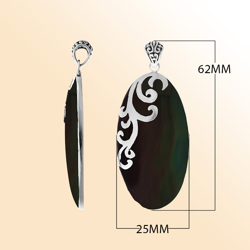 Elegant sterling silver Black Shell pendant with handcrafted scroll design made in Bali.