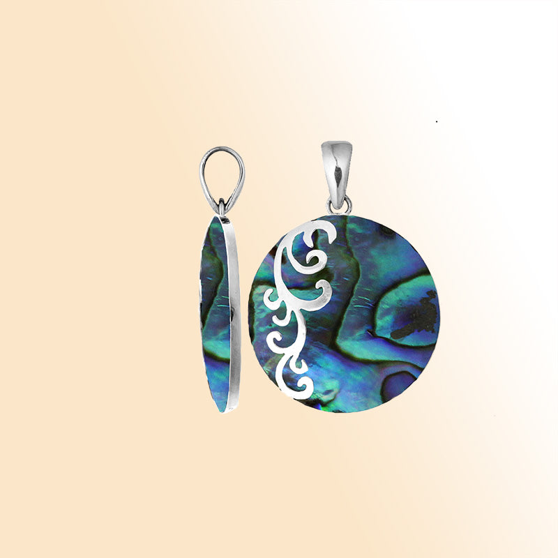 Artisan sterling silver pendant with vibrant abalone shell and flowing swirl accents in a polished finish.