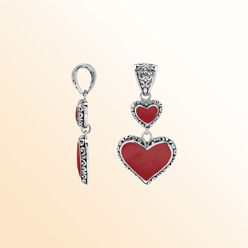 Artisan sterling silver double heart pendant with Red Coral and flowing Balinese accents.