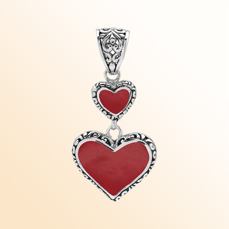 Artisan sterling silver double heart pendant with Red Coral and flowing Balinese accents.