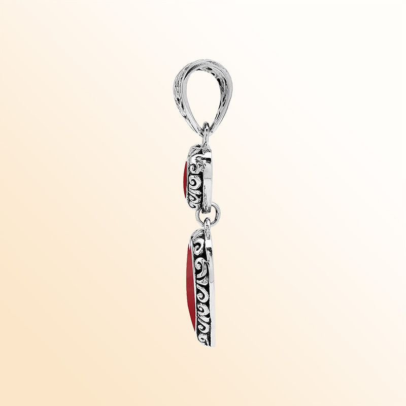 Artisan sterling silver double heart pendant with Red Coral and flowing Balinese accents.