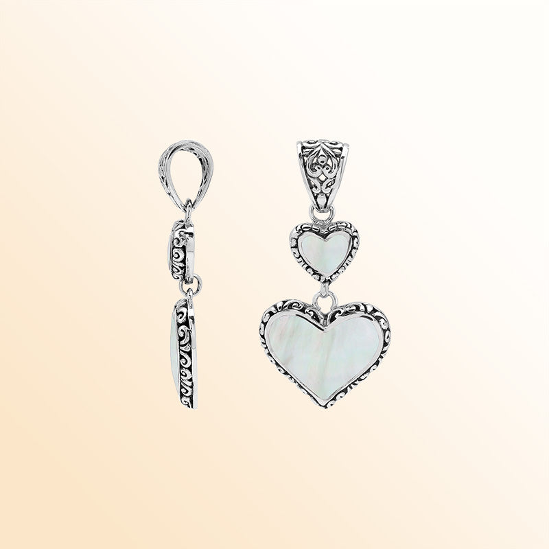 Artisan sterling silver double heart pendant with Mother of Pearl and Balinese accents.
