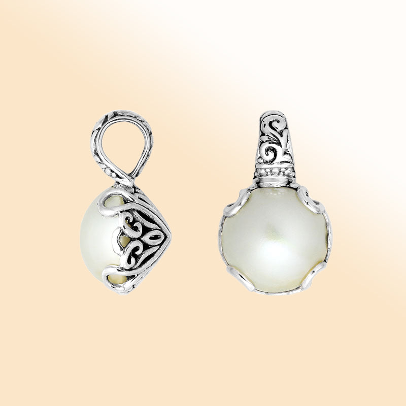 Artisan sterling silver Mabe Pearl pendant with delicate Balinese filigree design.
