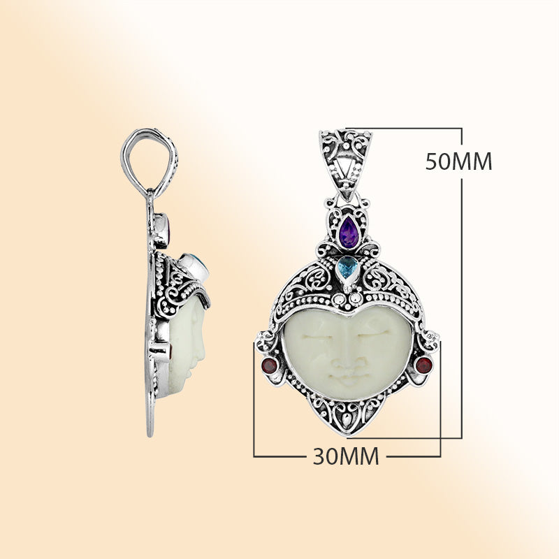 Artistic sterling silver Bone Face pendant with garnet, topaz and amethyst.