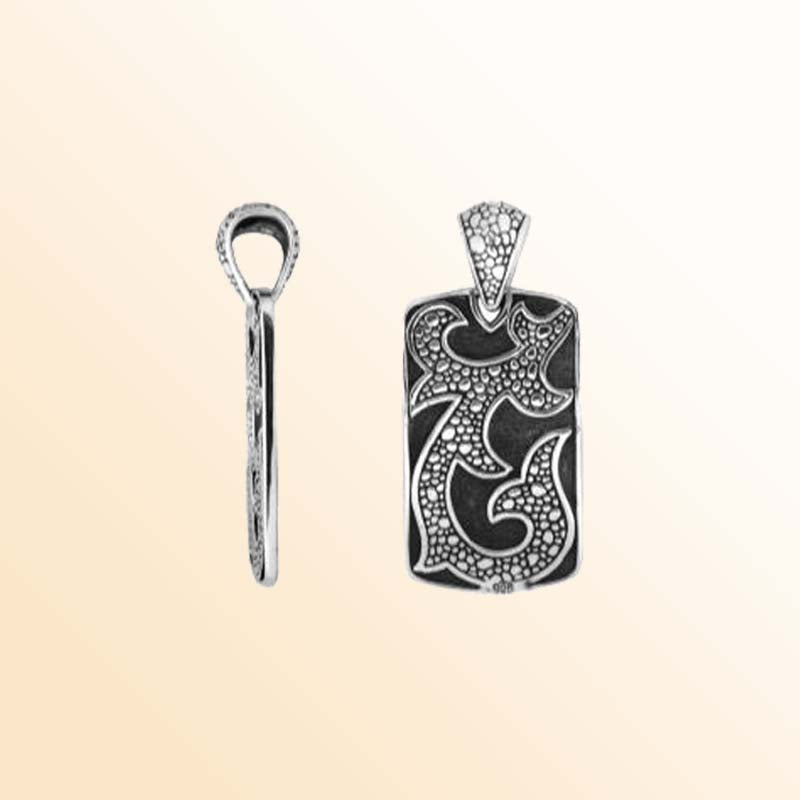 Artistic sterling silver rectangle pendant with tribal carved detailing.