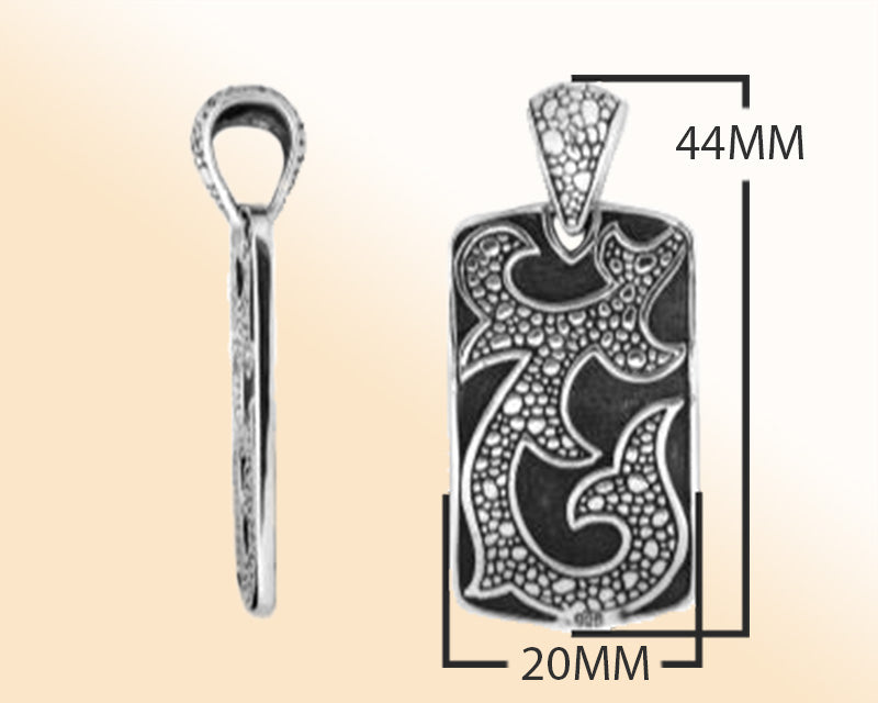 Artistic sterling silver rectangle pendant with tribal carved detailing.