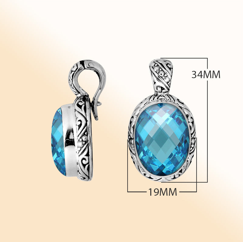 Handcrafted sterling silver oval pendant featuring faceted Blue Topaz Quartz with decorative Balinese accents.