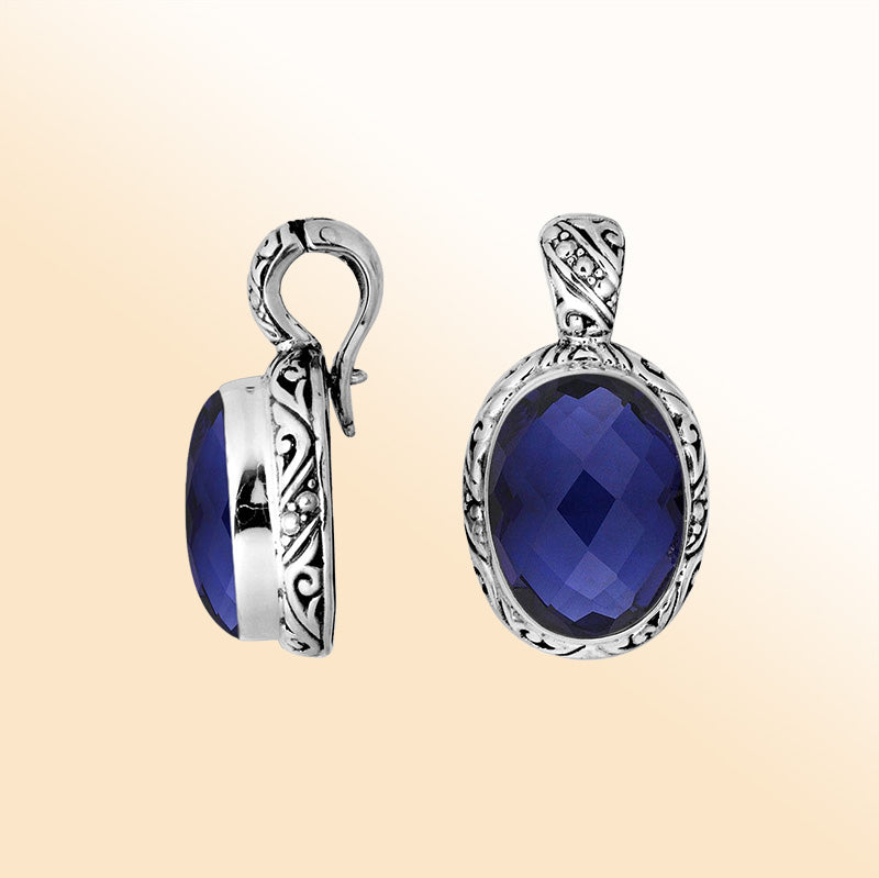 Handcrafted sterling silver pendant featuring faceted Blue Sapphire Quartz with artistic Balinese detailing and a polished high-gloss finish.