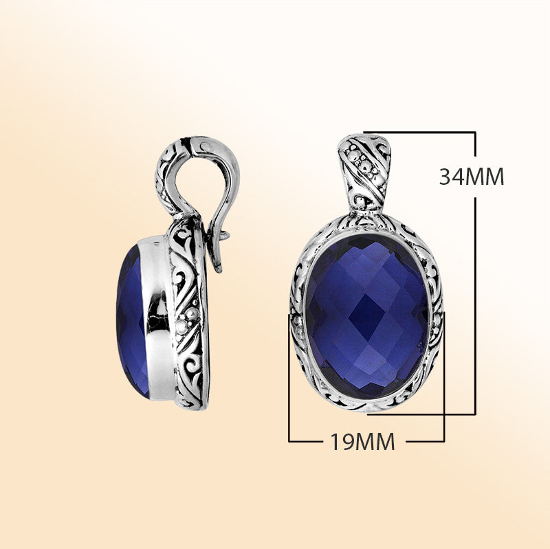 Handcrafted sterling silver pendant featuring faceted Blue Sapphire Quartz with artistic Balinese detailing and a polished high-gloss finish.
