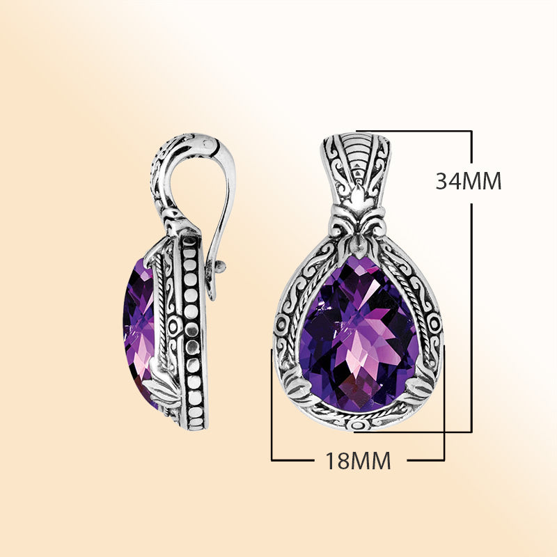 Handcrafted sterling silver pendant featuring a faceted Amethyst Quartz teardrop with artistic Balinese detailing and a glossy polished finish.