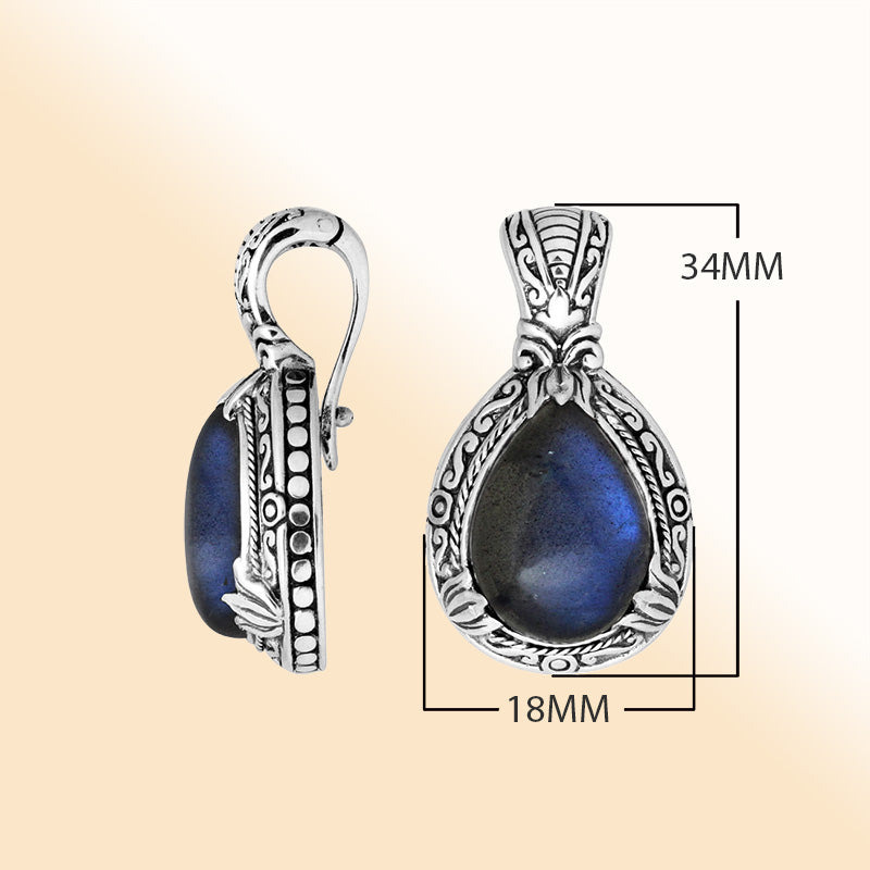 Sterling silver pear-shaped Labradorite pendant with enhancer bail and ornate Balinese detailing for elegant wear.