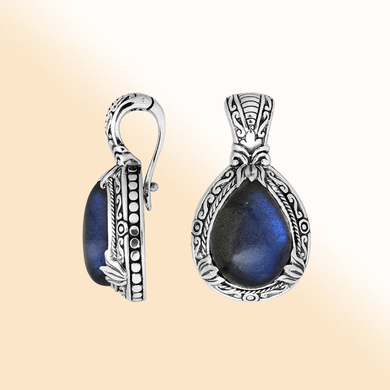 Sterling silver pear-shaped Labradorite pendant with enhancer bail and ornate Balinese detailing for elegant wear.